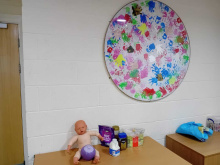 Baby, knitted boon and tea, coffee and sugar